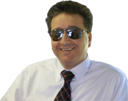 Rabih Dow headshot. Rabih is smiling, wearing a white dress shirt and tie with checkered pattern.